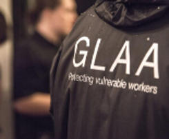 A close up of the GLAA branding on a GLAA worker's jacket