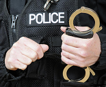 police holding handcuffs