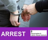 handcuffs on pair of hands arrest gangmasters and labour abuse authority