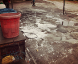 forecourt with soapy water and buckets