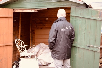 GLAA SIO Martin Plimmer looking inside shed