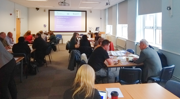 View of all delegates round tables at the Leicester workshop