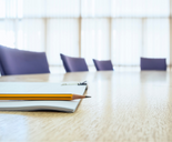 Business meeting table with pencil and notebook