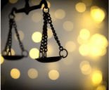 Scales of justice on bright lights background