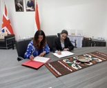 Sam Ireland Signing MOU With Tajikistan Colleague